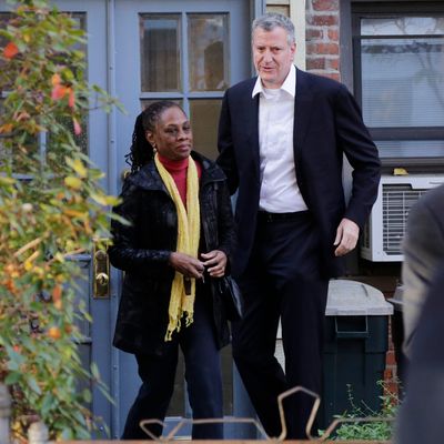 In this Nov. 6, 2013 photo, Chirlane McCray and her husband Bill de Blasio leave their house in the Park Slope neighborhood in the Brooklyn borough of New York. Now de Blasio faces a crucial early decision: should he leave Park Slope behind to move to the mayor’s official residence, stately Gracie Mansion on Manhattan’s Upper East Side?