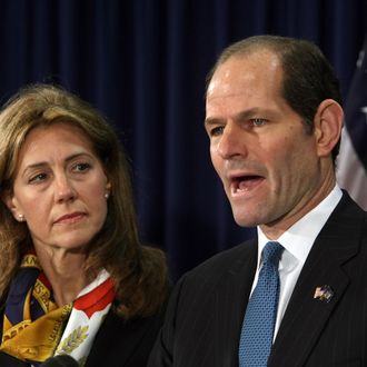 New York Governor Eliot Spitzer addresses the media with his wife Silda Wall at his office in New York, on March 12, 2008 to announce that he will resign from office after revelations that he had been a client of a prostitution ring. The resignation will take effect on March 17. Lieutenant Governor David Paterson will then take the office of governor.