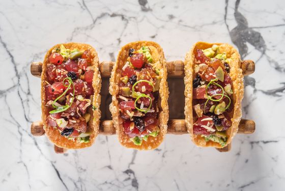 Tunapica tartare with crispy wonton, Spanish olives, currants, toasted coconut, almond, and avocado ceviche.