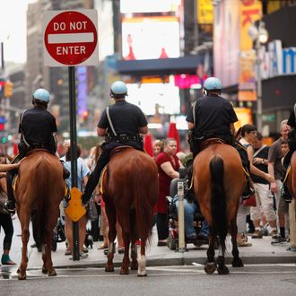 NEW YORK, NY - SEPTEMBER 10: Mounted New York Police Department officers stand watch over Times Square on September 10, 2011 in New York City. Law enforcement remains on high alert in New York and Washington D.C. after U.S. officials received a credible but unconfirmed terror threat to utilize car bombs on bridges or tunnels in New York or Washington. (Photo by Chip Somodevilla/Getty Images)