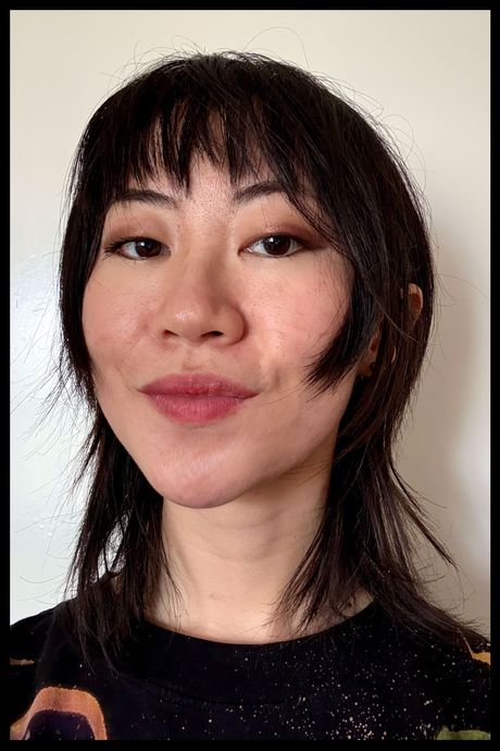 Author wearing Violette FR's Bisou Balm in Bonbon Coquelicot.