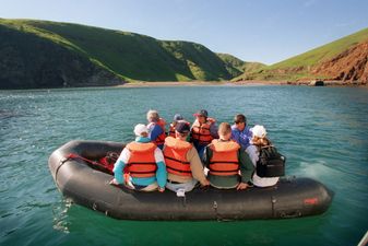 Visitors to Santa Cruz Island are transported by inflatable raft from Island Packers boat to Scorpio