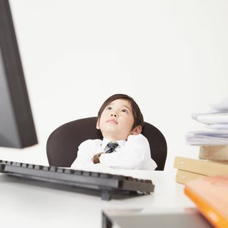 Boy as Office Worker Thinking In Office.