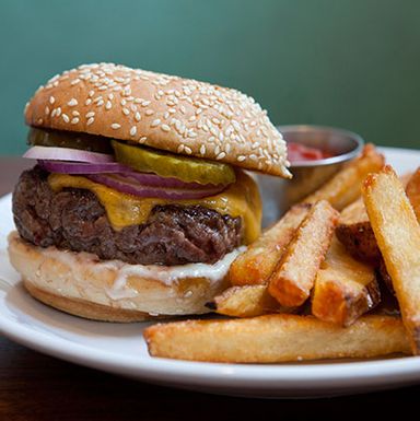 594 Union Ave., at Richardson St., Williamsburg; 347-529-4921
The restaurant is right around the corner from McCarren, and a recent staff revamp means an entirely new menu to match the new pool. The burger from ex chef and Fatty 'Cue alumn Dan Ross-Leutwyler is simple — grass-fed beef, Tillamook cheddar, pickles and onions — and a whole lot better than any post-swim sandwiches you ate growing up. Our advice: Pair it with a cocktail from beverage director Justin Lane Briggs' new drink list.
