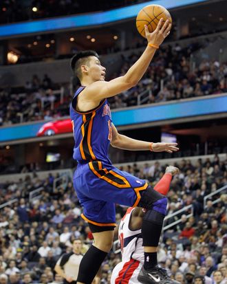 Jeremy Lin #17 of the New York Knicks puts up a shot in front of Shelvin Mack #22 of the Washington Wizards during the first half at Verizon Center on February 8, 2012 in Washington, DC. 