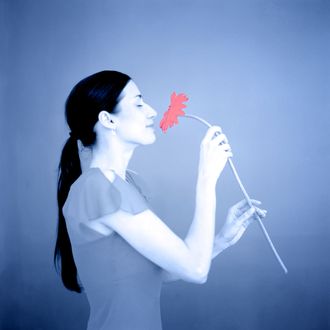 Woman Smelling Flower