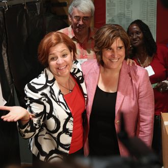 Democratic mayoral candidate Christine Quinn (L) and her wife Kim Catullo embrace after casting their votes in the primary election for New York City mayor on September 10, 2013 in New York City. Quinn, trailing in the polls, is hoping to garner enough votes to compete in a runoff election to be the Democratic candidate. 
