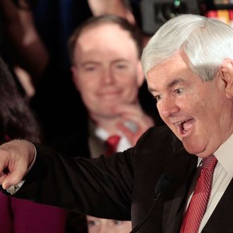 Republican presidential candidate, former Speaker of the House Newt Gingrich celebrates as he arrives for a primary night rally January 21, 2012 in Columbia, South Carolina. 