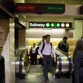 NEW YORK, NY - AUGUST 29: Commuters walk to their subway August 29, 2011 in New York City. One day after Hurricane Irene hit New York the mass transit system, including subways and buses, began moving again in a limited capacity in time for Monday's rush hour. (Photo by Joe Raedle/Getty Images)