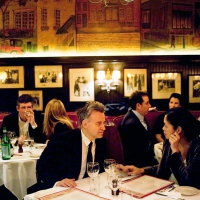 Keith McNally, Brooke Shields, Jay McInerney, Jerry Seinfeld, and George Stephanopoulos all sit in the back dining room at Minetta Tavern.