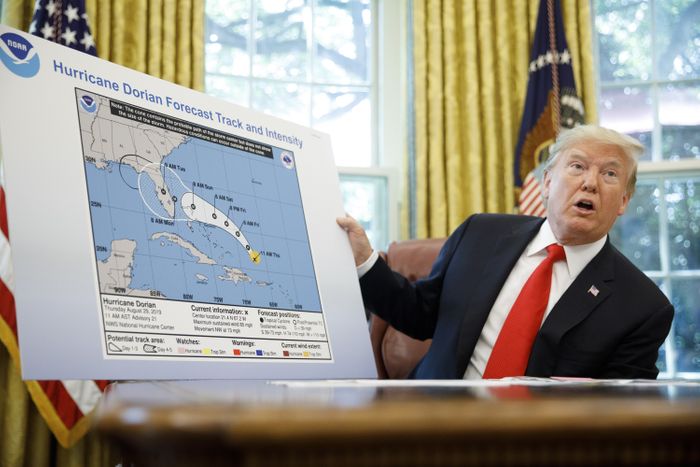 President Donald Trump presents a map marked with a Sharpie to extend the area affected by Hurricane Dorian on September 4, 2019.