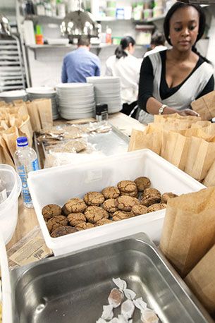 Before service: front-of-house staff stuffing goodie bags containing confections made by all the headlining chefs.