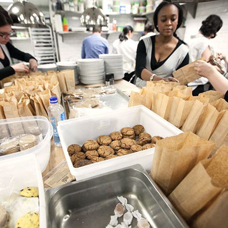 Before service: front-of-house staff stuffing goodie bags containing confections made by all the headlining chefs.