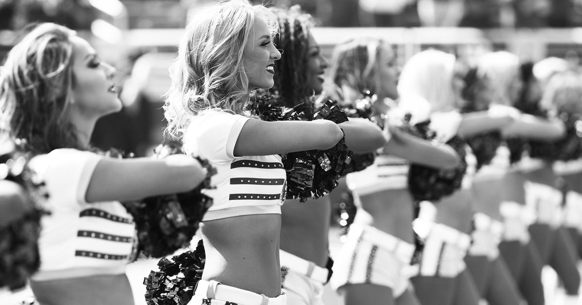 Woman becomes first NFL cheerleader to take a knee during national