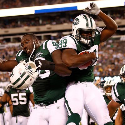 Eddie Jones #99 and Muhammad Wilkerson #96 of the New York Jets.