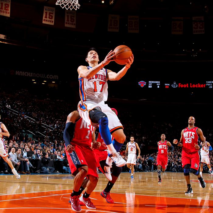 Jeremy Lin #17 of the New York Knicks drives to the basket against Sundiata Gaines #1 of the New Jersey Nets on February 20, 2012 at Madison Square Garden in New York City. 