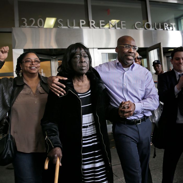 Jonathan Fleming, second from right, exits the courthouse with his mother Patricia Fleming, second from right, in New York, Tuesday, April 8, 2014. Jonathan Fleming, who spent almost a quarter-century behind bars for murder, was freed in New York City on Tuesday and cleared of a killing that happened when he was 1,100 miles away on a Disney World vacation. (AP Photo/Seth Wenig)