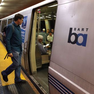 A Bay Area Rapid Transit (BART) passenger boards a train on October 15, 2013 in San Francisco, California.