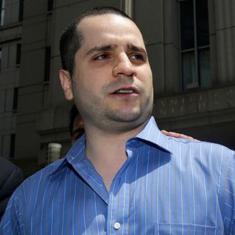 With his mother Elizabeth Valle by his side, GIlberto Valle, left, makes a short statement to the assembled media as he leaves Manhattan federal court in New York, Tuesday, July 1, 2014. A federal judge has overturned the conviction of Gilberto Valle, a former New York City police officer accused of plotting to kidnap, kill and eat young women. 