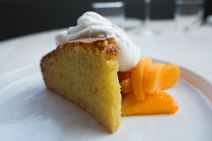 Olive-oil cake with persimmon, grappa, and honey whipped cream.