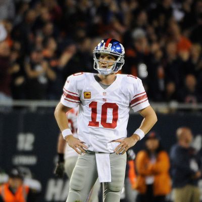 Eli Manning #10 of the New York Giants after throwing an interception late in the fourth quarter against the Chicago Bears on October 10, 2013 at Soldier Field in Chicago, Illinois. The Chicago Bears defeated the New York Giants 27-21.