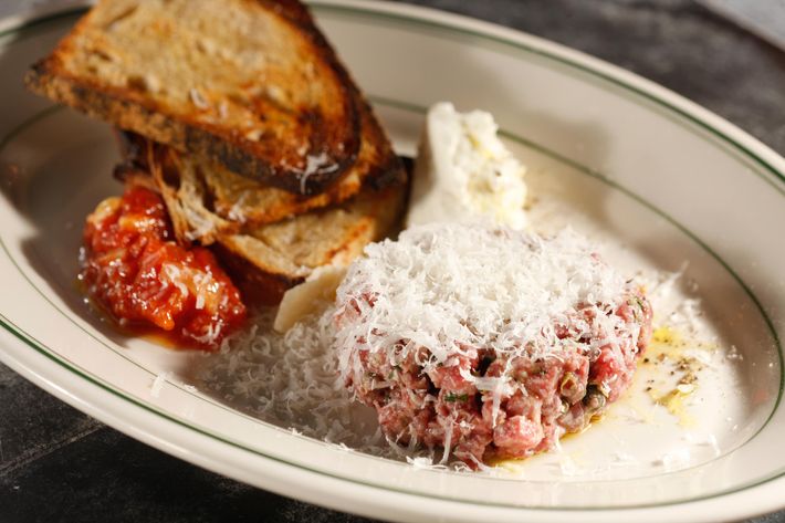 The meatball tartare incorporates traditional ingredients from the Italian-American classic including chives and parsley for seasoning along with ricotta and red sauce on the side.