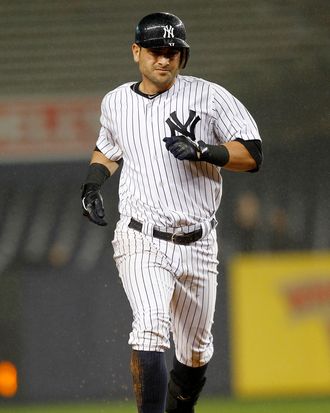 Fancisco Cervelli of the New York Yankees rounds the bases on his solo home run in a game against the Baltimore Orioles at Yankee Stadium on September 6, 2011.