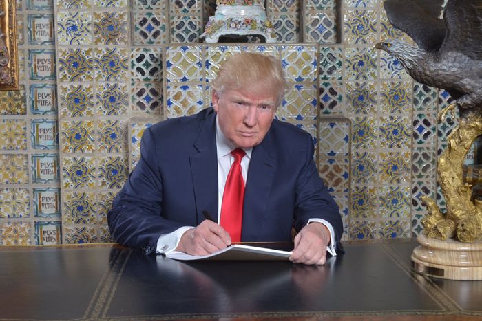 Donald Trump sitting at a desk at Mar-a-Lago writing his inauguration speech in Sharpie in January 2017.