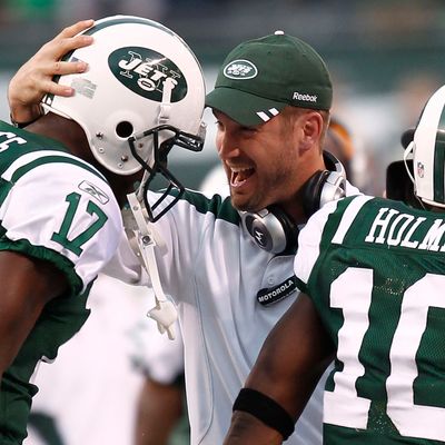 Brian Schottenheimer celebrates with Plaxico Burress #17.