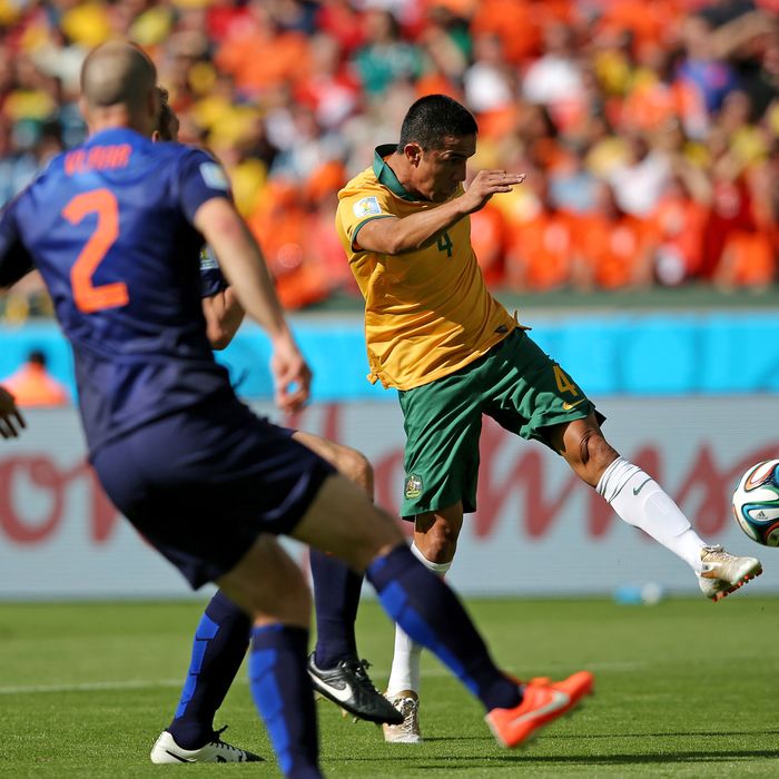 Tim Cahill of Australia shoots and scores his team's first goal during the 2014 FIFA World Cup Brazil Group B match between Australia and Netherlands at Estadio Beira-Rio on June 18, 2014 in Porto Alegre, Brazil