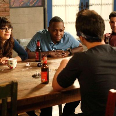 NEW GIRL: L-R: Jess (Zooey Deschanel), Winston (Lamorne Morris) and Schmidt (Max Greenfield) watch as Nick plays Feely-Cup in the 