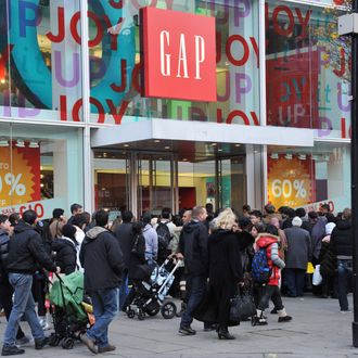 LONDON, UNITED KINGDOM - DECEMBER 26: Eager shoppers descend on stores on Oxford Street for the Boxing Day sales on December 26, 2011 in London, England. Dubbed 