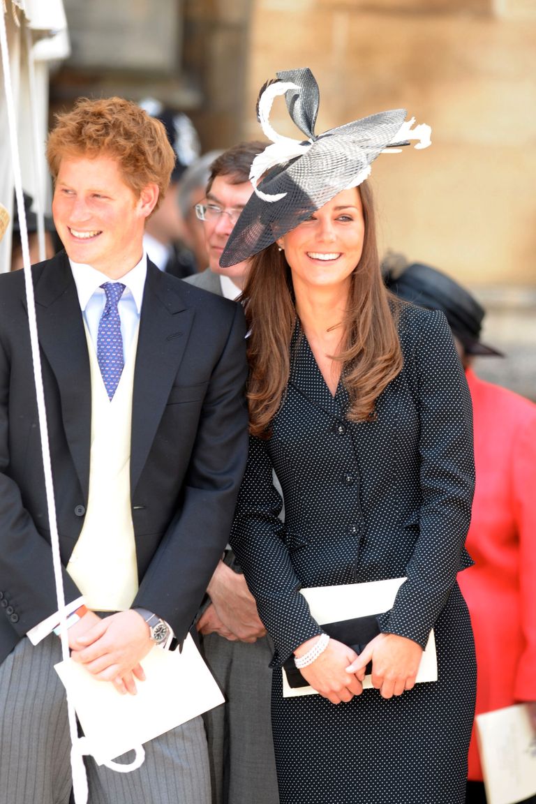 WINDSOR, ENGLAND - JUNE 16: (NO PUBLICATION IN UK MEDIA FOR 28 DAYS) Prince Harry and Prince William’s girlfriend Kate Middleton laugh together as they watch the Order of the Garter procession at Windsor Castle on June 16, 2008 in Windsor, England. (Photo by POOL/ Tim Graham Picture Library/Getty Images) *** Local Caption *** Prince Harry;Kate Middleton