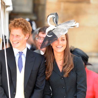 WINDSOR, ENGLAND - JUNE 16: (NO PUBLICATION IN UK MEDIA FOR 28 DAYS) Prince Harry and Prince William’s girlfriend Kate Middleton laugh together as they watch the Order of the Garter procession at Windsor Castle on June 16, 2008 in Windsor, England. (Photo by POOL/ Tim Graham Picture Library/Getty Images) *** Local Caption *** Prince Harry;Kate Middleton