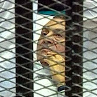 EDITORS NOTE THIS IS A RECROPPED VERSION OF LON868 - This video image taken from Egyptian State Television shows 83-year-old Hosni Mubarak laying on a hospital bed inside a cage of mesh and iron bars in a Cairo courtroom Wednesday Aug. 3, 2011 as his historic trial began on charges of corruption and ordering the killing of protesters during the uprising that ousted him. The scene, shown live on Egypt's state TV, was Egyptians' first look at their former president since Feb. 10, the day before his fall when he gave a defiant speech refusing to resign. (AP Photo/Egyptian State TV) EGYPT OUT