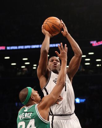 Joe Johnson #7 of the Brooklyn Nets gets the shot off over Paul Pierce #34 of the Boston Celtics at the Barclays Center on November 15, 2012 in the Brooklyn borough of New York City.