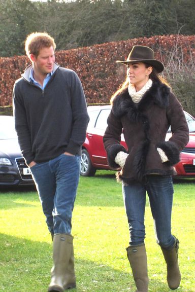 SANDRINGHAM, NORFOLK, UK, DECEMBER 30 2011: Prince Harry and Kate Middleton, the Duchess of Cambridge, arrive at Castle Rising near Sandringham, Norfolk on Christmas eve in matching Wellington boots to watch Prince William play in a football match organised by Lord Howard.(Credit: Newsteam)