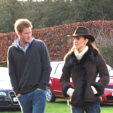 SANDRINGHAM, NORFOLK, UK, DECEMBER 30 2011: Prince Harry and Kate Middleton, the Duchess of Cambridge, arrive at Castle Rising near Sandringham, Norfolk on Christmas eve in matching Wellington boots to watch Prince William play in a football match organised by Lord Howard.(Credit: Newsteam)