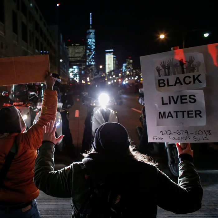 NEW YORK, NY - DECEMBER 4: Demonstrators watched by New York City police block the West Side Highway following yesterday's decision by a Staten Island grand jury not to indict a police officer who used a chokehold in the death of Eric Garner in July, on December 4, 2014 in New York City. The grand jury declined to indict New York City Police Officer Daniel Pantaleo in Garner's death. (Photo by Kena Betancur/Getty Images)
