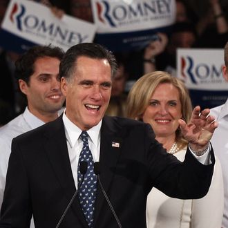 MANCHESTER, NH - JANUARY 10: Republican presidential candidate and former Massachusetts Gov. Mitt Romney (C) speaks during his primary night rally with members of his family following the 