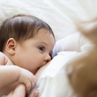 A mother breastfeeding.