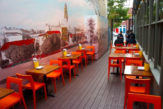 The outdoor seating area, featuring heat lamps and the mural we showed you earlier by artist Paul Madonna.
