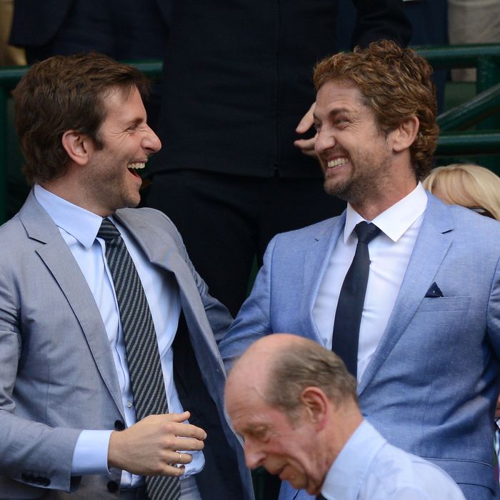 Bradley Cooper and Gerard Butler attend the Mens Singles Final on Day 13 of the Wimbledon Lawn Tennis Championships at the All England Lawn Tennis and Croquet Club on July 7, 2013 in London, England.