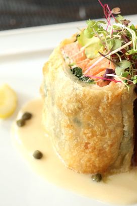 Farm-raised salmon wrapped in puff pastry, with Meyer lemon-caper aioli