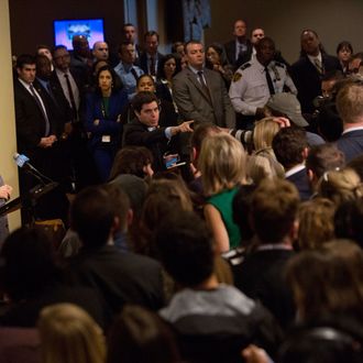 An aide selects a reporter to ask Hillary Clinton, former U.S. secretary of state, left, a question during a news conference at the United Nations (UN) in New York, U.S., on Tuesday, March 10, 2015. Clinton defended the legality of her use of a private e-mail account and server while she served as secretary of state, saying that she had done so out of a desire for convenience but should have used a government account for work purposes. Photographer: Victor J. Blue/Bloomberg via Getty Images