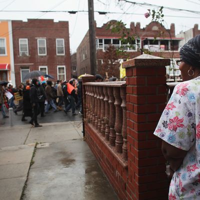 NEW YORK, NY - DECEMBER 06: Community activists and over two hundred members of the Occupy Wall Street movement march in the impoverished community of East New York to draw attention to foreclosed homes in the community on December 6, 2011 in the Brooklyn borough of New York City. The group said they would occupy a home and would hand the property over to a homeless family. In what organizers are describing as a 