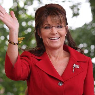 MANCHESTER, NH - SEPTEMBER 05: Former Alaska governor Sarah Palin waves during a Tea Party Express rally on September 5, 2011 in Manchester, New Hampshire. Hundreds of people attended the rally that is part of the 'Reclaiming America' bus tour traveling through 19 states and visiting 29 cities before arriving in Tampa, Florida for a presidential debate co-sponsored by CNN on September 12. (Photo by Justin Sullivan/Getty Images)