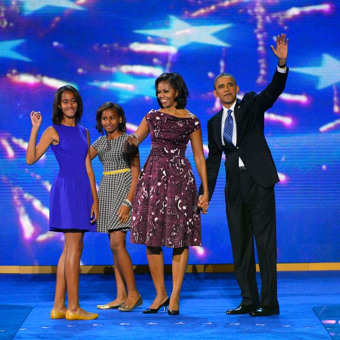 Malia, Sasha, Michelle, and Barack Obama.
