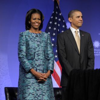 President Barack Obama and first lady Michelle Obama arrive to attend a groundbreaking ceremony at the construction site of the Smithsonian National Museum of African American History and Culture in Washington, Wednesday, Feb. 22, 2012.