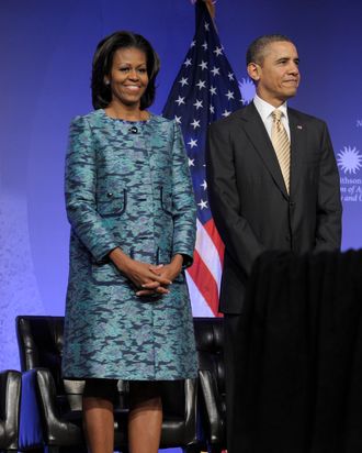 President Barack Obama and first lady Michelle Obama arrive to attend a groundbreaking ceremony at the construction site of the Smithsonian National Museum of African American History and Culture in Washington, Wednesday, Feb. 22, 2012.